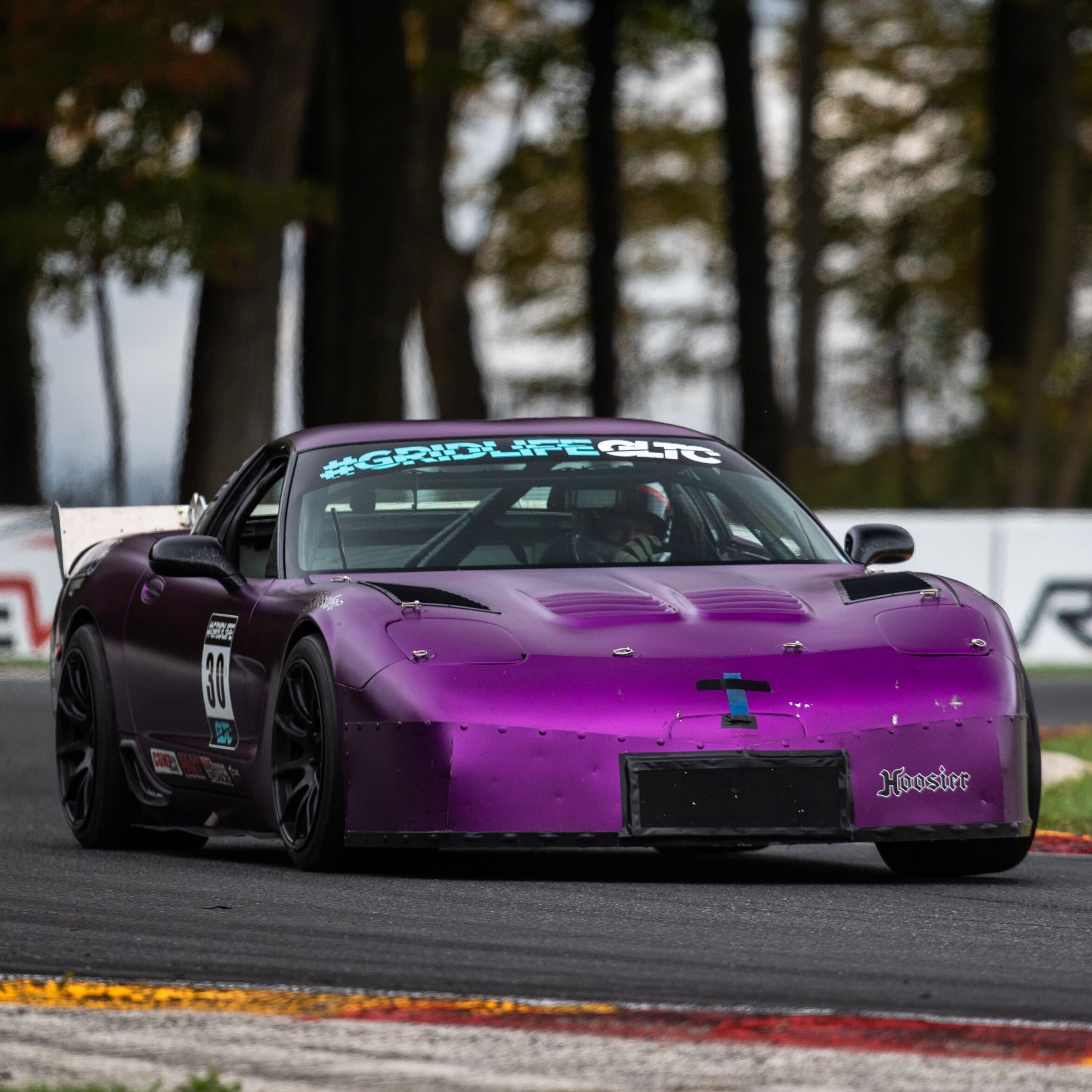 Retired GRIDLIFE GLTC window banner on corvette