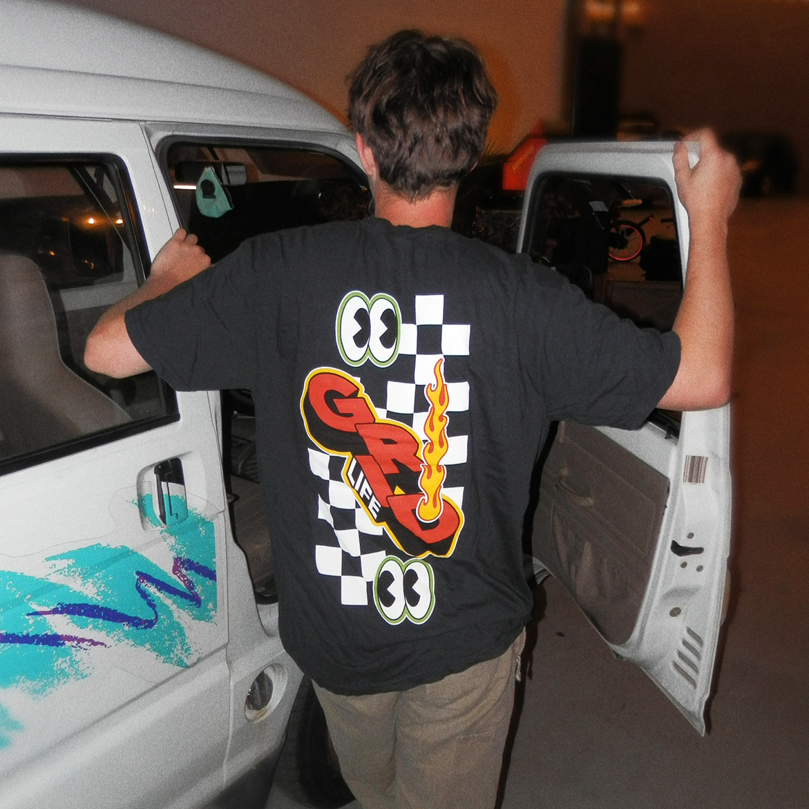 GRIDLIFE black peekers tshirt being worn while working on the kei truck 