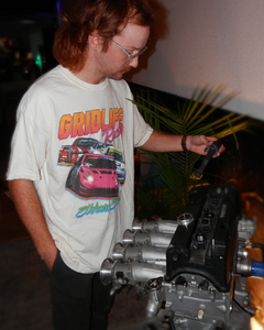 GRIDLIFE Elkhart Special being worn while a Honda engine is examined
