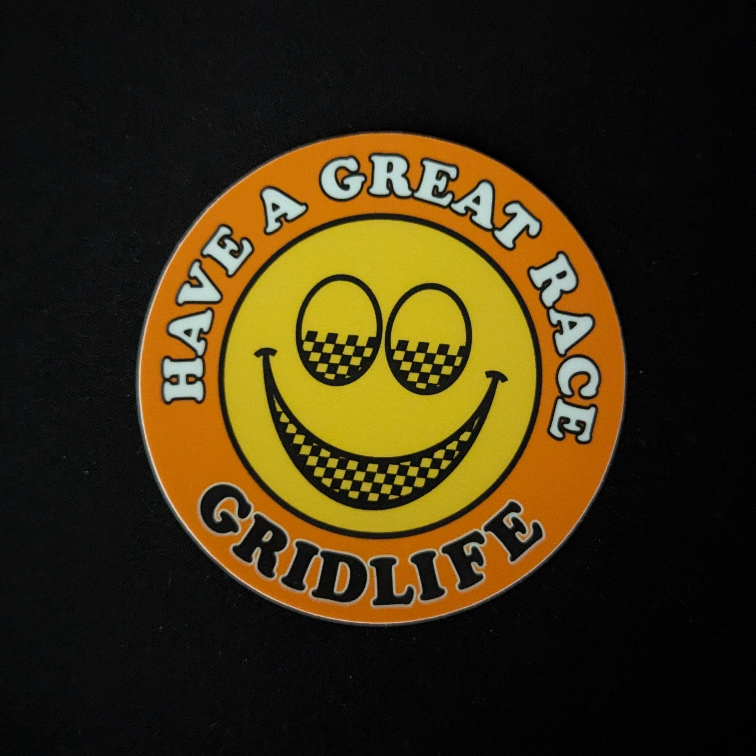 Orange GRIDLIFE smiley slap sticker 