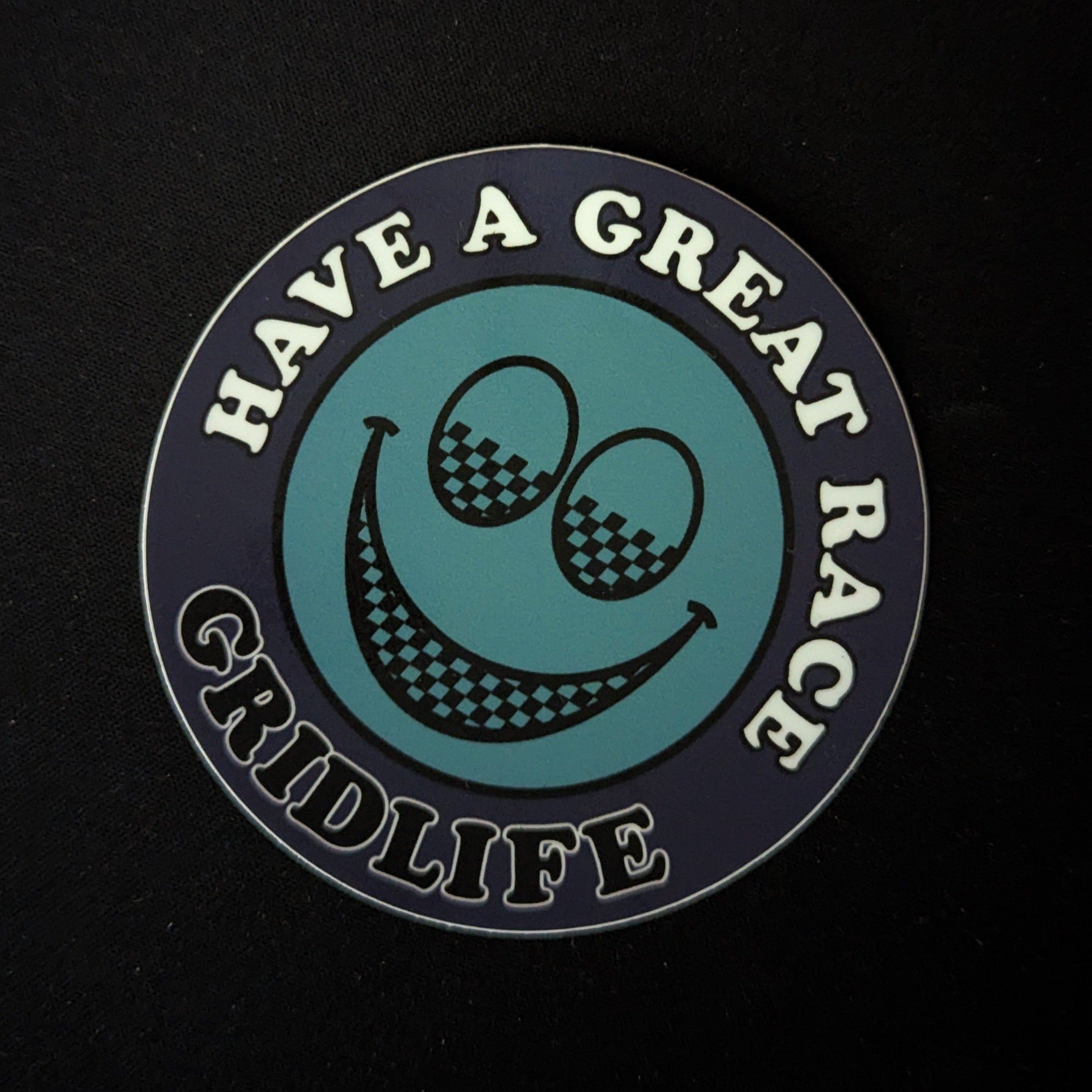 Blue GRIDLIFE smiley slap sticker 