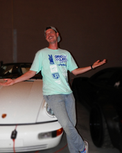 GRIDLIFE midwest 2023 lineup tee being worn proudly in front of speedster