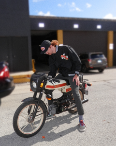 Moped rider wearing GRIDLIFE lightweight bomber jacket 