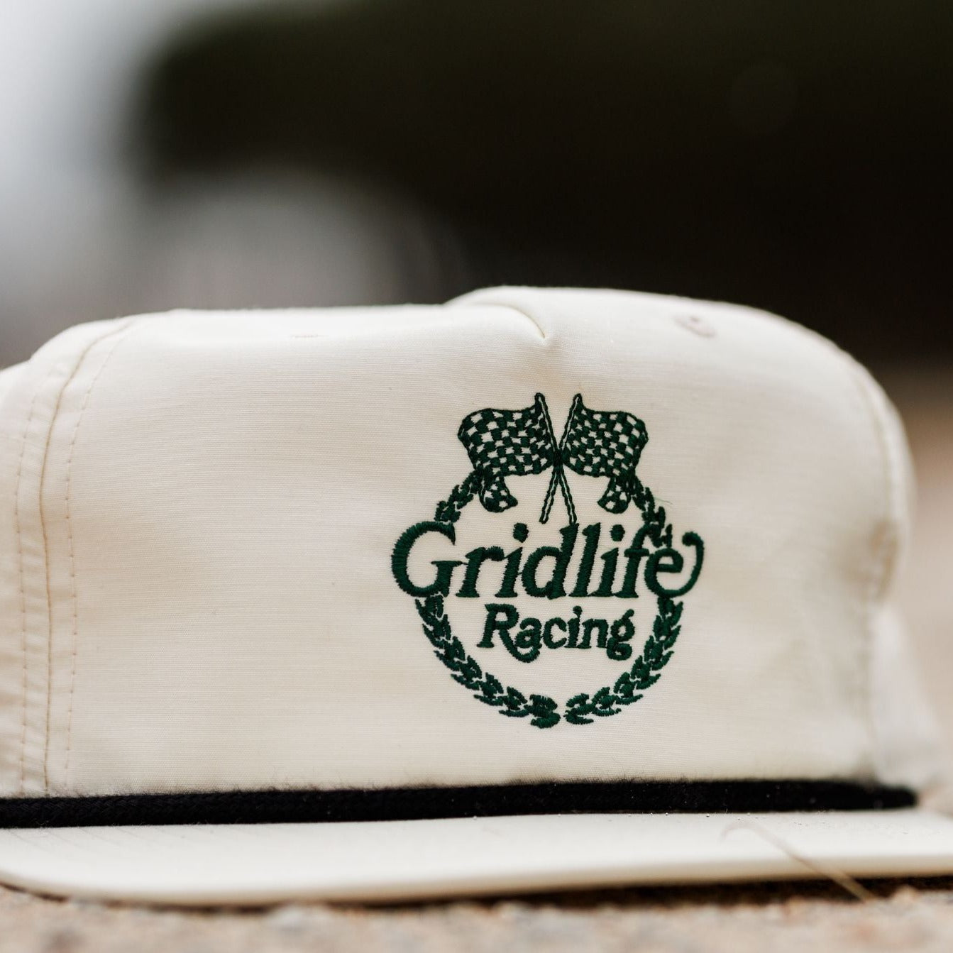 Cream colored GRIDLIFE Racing Laguna Crest hat photographed