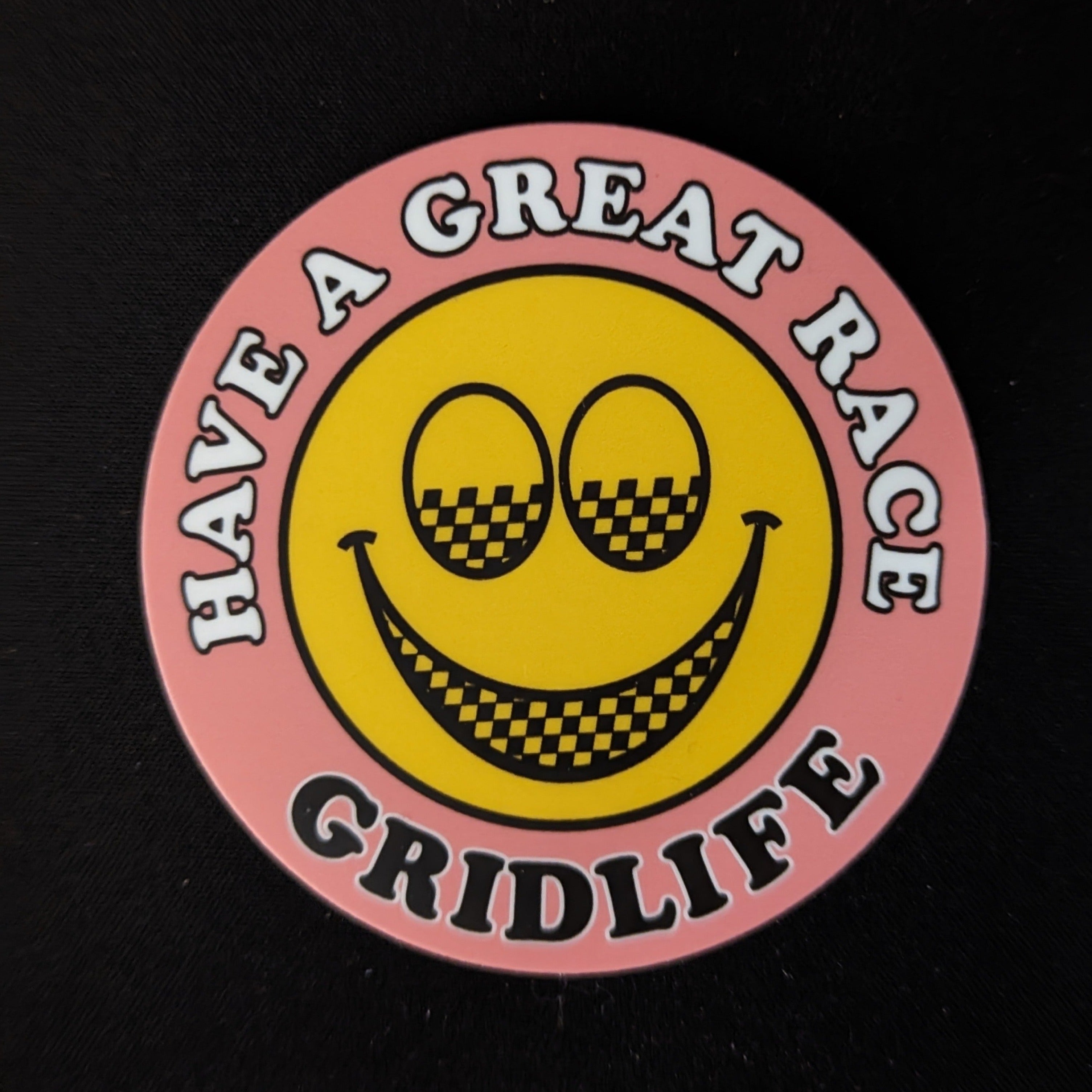 Pink GRIDLIFE smiley slap sticker 
